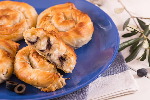 istock Pastry swirls with cheese and olive filling. 1283016329