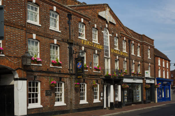 Street in Godalming, Surrey, England Mixed architecture of old buildings in shopping street, Godalming, Surrey, England. The Kings Arms Royal Hotel surrey hotel southeast england england stock pictures, royalty-free photos & images