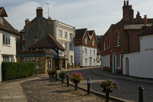 Mixed architecture of old buildings in shopping street, Godalming, Surrey, England. No people.
