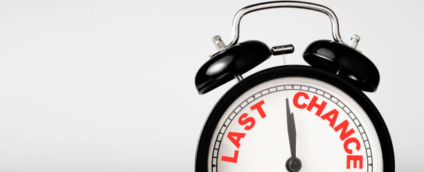 istock Last chance wording print screen on black alarm clock. 1283018296
