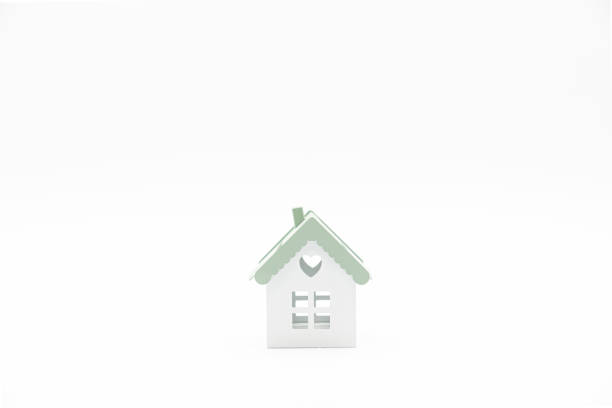 istock Small conceptual house isolated on white background with plenty of copy space. 1283019562