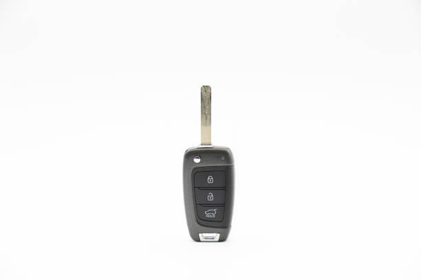 istock Electronic car key with buttons for remote opening and unlocking isolated on white background. 1283019587