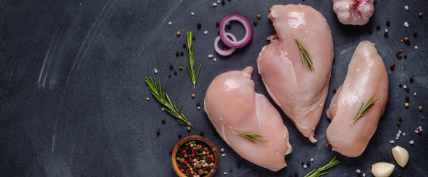 istock Raw chicken fillet with spices and herbs 1283021152
