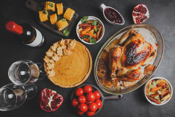 istock Thanksgiving party table with turkey, vegetables and pumpkin pie 1283021287