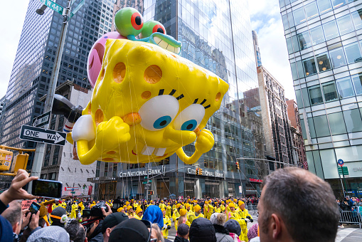 New York City, NY, USA- November 28, 2019: SpongeBob SquarePants Balloon floats down Central Park at annual Macy's Thanksgiving Day Parade