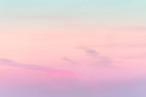 Photo of sunset background. sky with soft and blur pastel colored clouds.  gradient cloud on the beach resort. nature. sunrise.  peaceful morning. Instagram toned style
