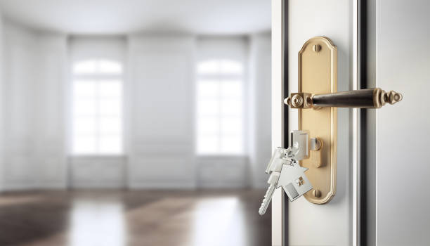 istock Open Door with Key to apartment 1283022765