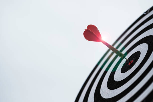 istock Dart arrow hit dartboard and goal with sunlight ,Setup objectives and target for business investment concept. 1283024031
