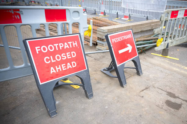 istock Footpath closed sign for pedestrian safety from road construction 1283024483
