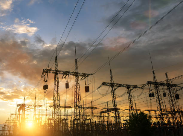 istock High-voltage power lines at sunset or sunrise. High voltage electric transmission tower 1283025896