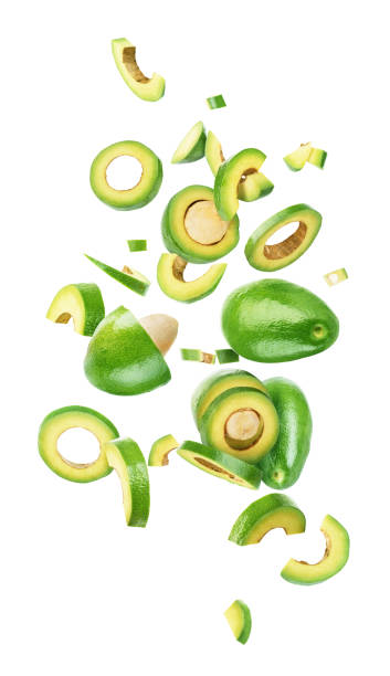 istock Avocado sliced and falling isolated on a white background 1283025927