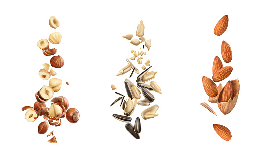 Set of nuts and seeds in flight on a white background