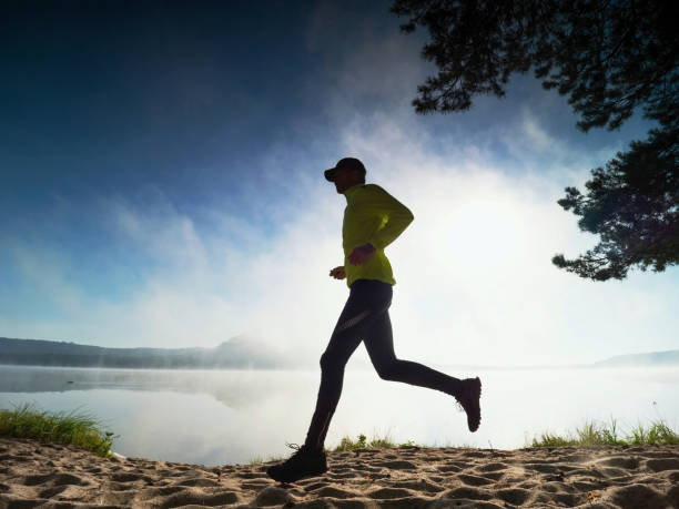 istock Outdoor run. Healthy lifestyle man doing morning training 1283026475