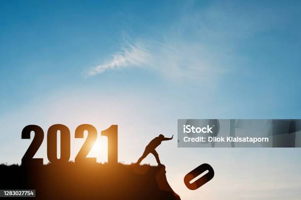 Man Push Number Zero Down The Cliff Where Has The Number 2021 With Blue Sky And Sunrise It Is Symbol Of Starting And Welcome Happy New Year 2021 Stock Photo - Download Image Now