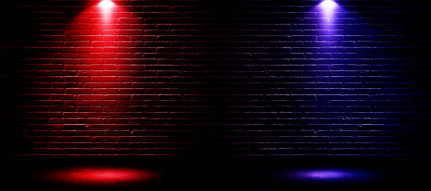 istock Studio dark room with fog or mist and lighting effect red and blue on concrete floor and brick wall grunge texture background. 1283030096