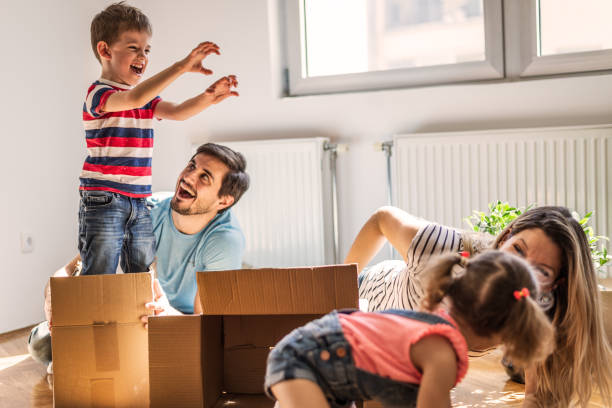 istock Playful family into new home 1283030128