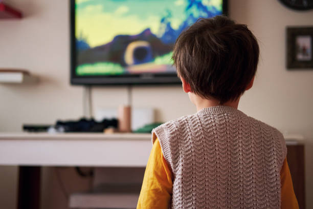 istock 4-5 years old child watching tv at home 1283030311