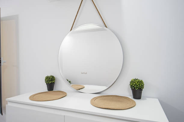 istock Round mirror on dresser unit in luxury home 1283030604