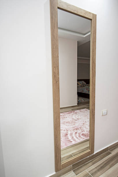 istock Full length mirror on wall of bedroom in luxury home 1283030607