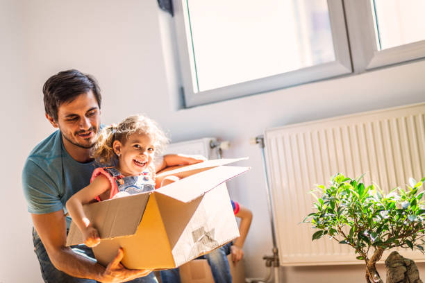 istock Playful family into new home 1283030875