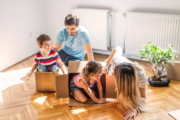 istock Playful family into new home 1283031525