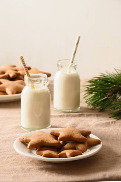 istock Milk and gingerbread homemade cookie in home interior. 1283031821
