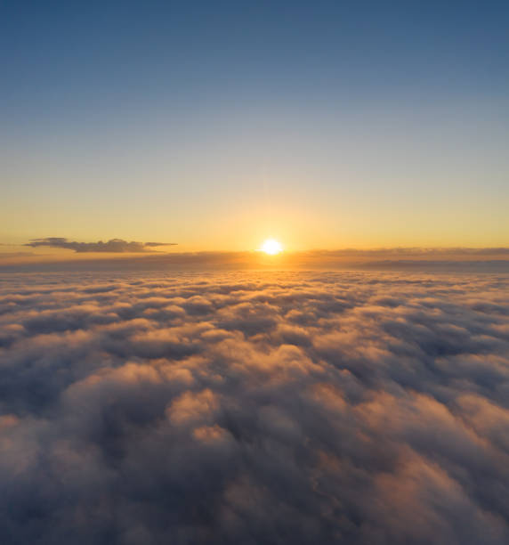 istock Beautiful sunrais cloudy sky from aerial view. Airplane view above clouds 1283034206