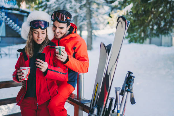 istock Couple on winter holiday drinking hot tea 1283037504
