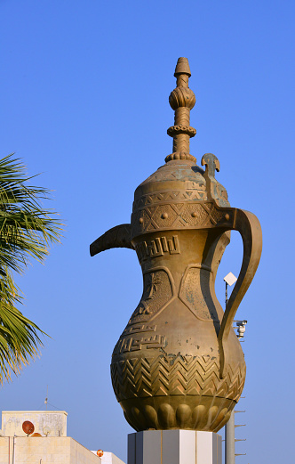 Dammam, Eastern Province, Saudi Arabia / KSA: giant Arabic style coffee pot and blue sky - King Fahd Road, Madinat Al Umal.
