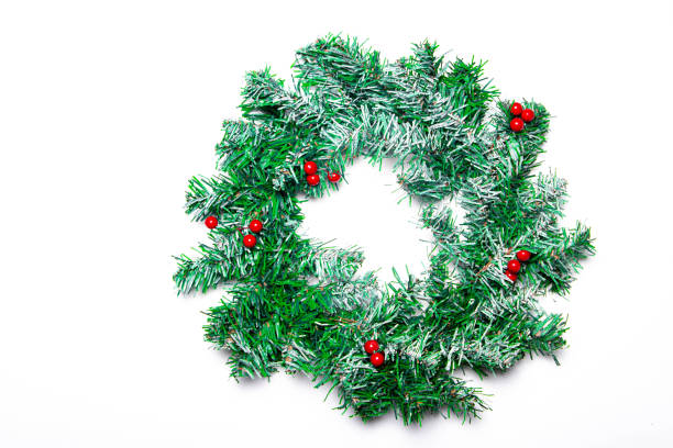 istock Christmas tree wreath on a white background.Spruce branch. Balls for the Christmas tree. Decoration Holiday. A wreath and a gift. New year and Christmas. Copy space. A wreath of fir branches. 1283041397