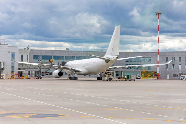 istock Plane outside the terminal building waiting for the flight. 1283041906