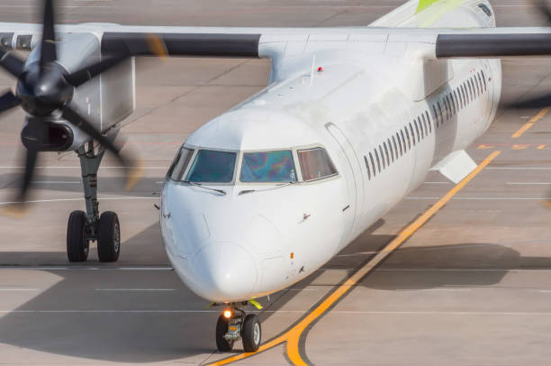 istock Started rotating engine propeller while taxiing, marking the way to the runway. 1283041943