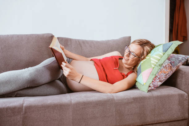 istock Pregnant woman reading a book 1283044255