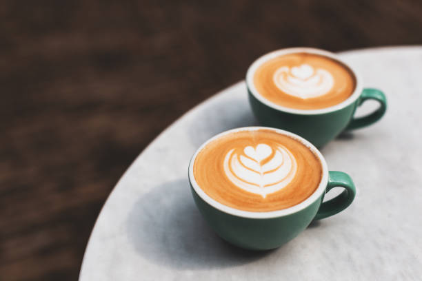 istock Two beautiful cups of cappuccino on the table. 1283045637