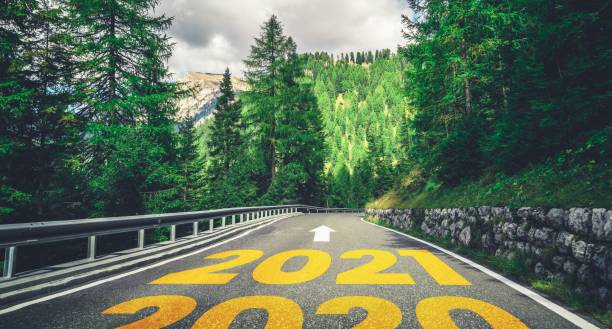istock 2021 New Year road trip travel and future vision concept . 1283045700
