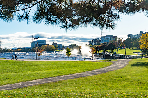 Niagara falls park in Autumn.   In the background is the American Falls.