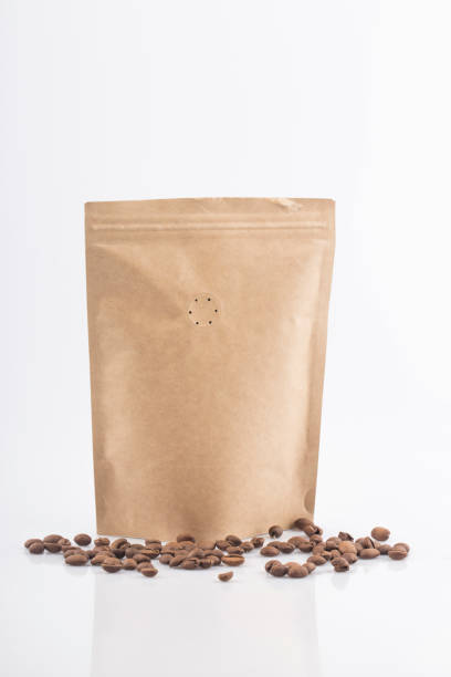 istock Coffee craft paper bag isolated on white background. 1283047470