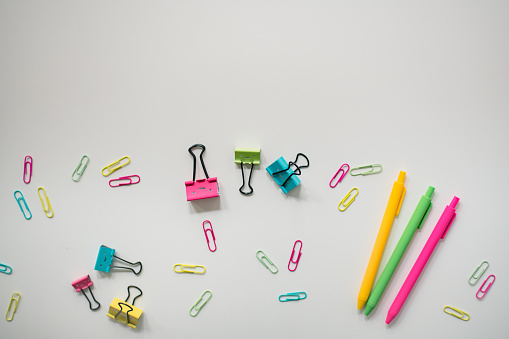 brightly colored office supplies on white background in Washington, DC, United States