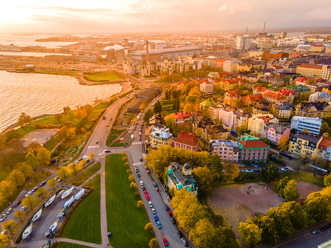 Aerial view of Helsinki city in autumn. The view shows the colorful rooftops and beautiful buildings in Helsinki. Aerial view of city center. The houses are arranged in nice way.