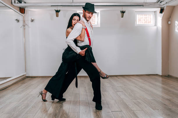 istock Man and woman dancing in dancing studio 1283050755