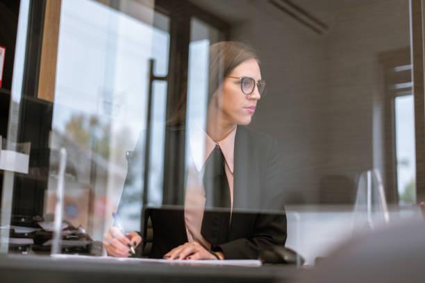 istock Serious young woman entrepreneur at work in office 1283051002