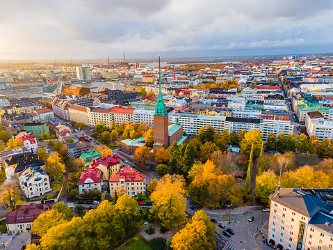 This image shows drone Aerial view of Helsinki, capital of Finland in autumn time. Colorful autumn leaves can be seen in the image.