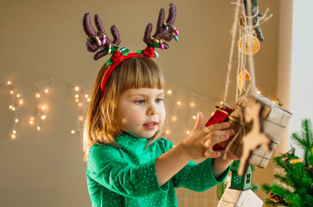 istock Beautiful little 3-years girl holding gift box 1283052121