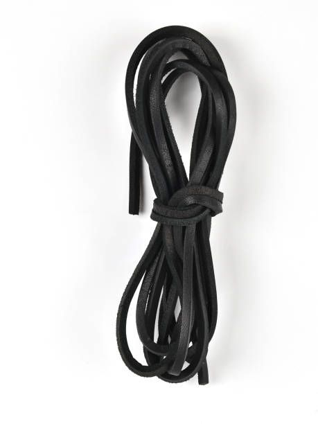 Leather shoe laces on a white background.