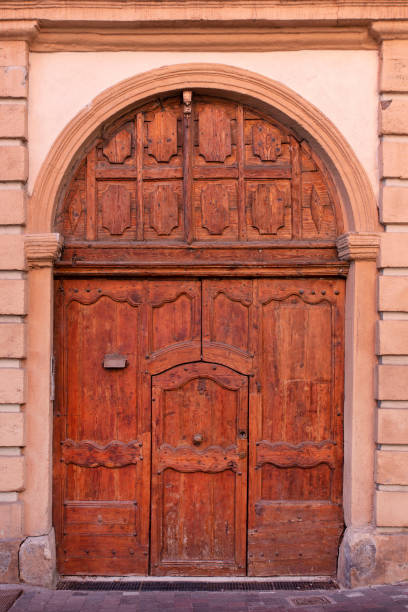 istock Old wooden church door 1283059349