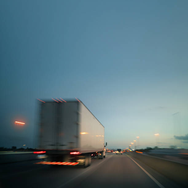 istock White semi truck at sunset in a MIami highway 1283060360