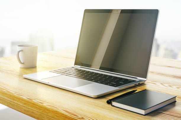 istock Open laptop on a wooden table with cup of coffee. Mock up. 3D Rendering 1283060936