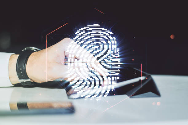 istock Double exposure of abstract creative fingerprint hologram with finger clicks on a digital tablet on background, protection of personal information concept 1283061652