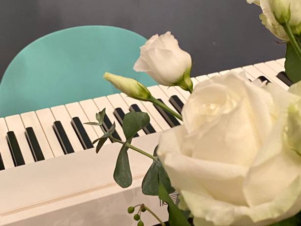 istock White flowers and piano keyboard 1283063747