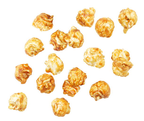 istock Popcorn caramel drops on a white background, popcorn levitating. Isolated 1283063922